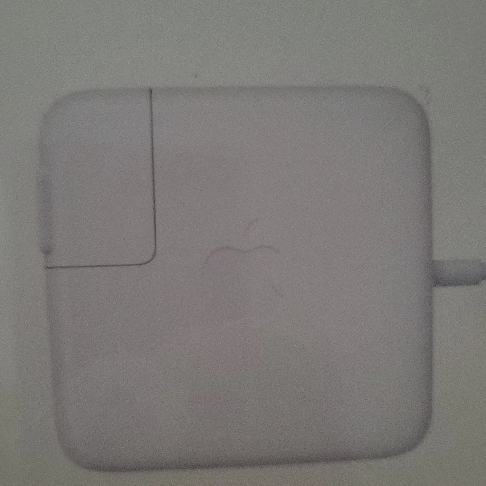 Apple 45W Magsafe 2 power adapter for MacBook Air.